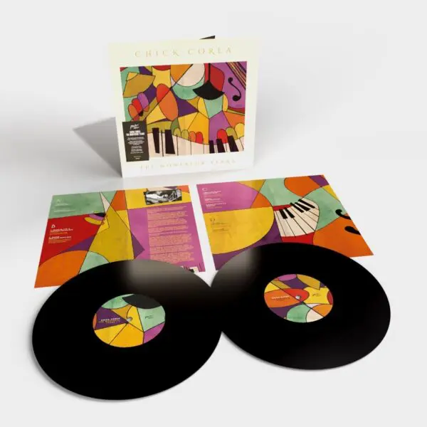 Two black vinyl records rest on vibrant inner sleeves with piano keys and geometric shapes. Behind them is the "Chick Corea, The Montreux Years, Double Vinyl" album cover, celebrating his legendary performances.