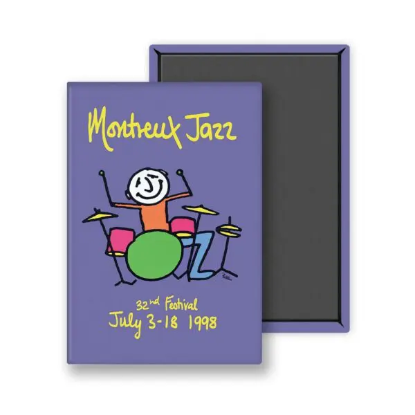 Un carnet violet "Magnet Phil Collins, 1998" comporte un dessin de batteur enfantin et un texte jaune-vert "Montreux Jazz 32nd Festival July 3-18 1998" sur la couverture. Il est présenté à côté de sa couverture arrière noire.