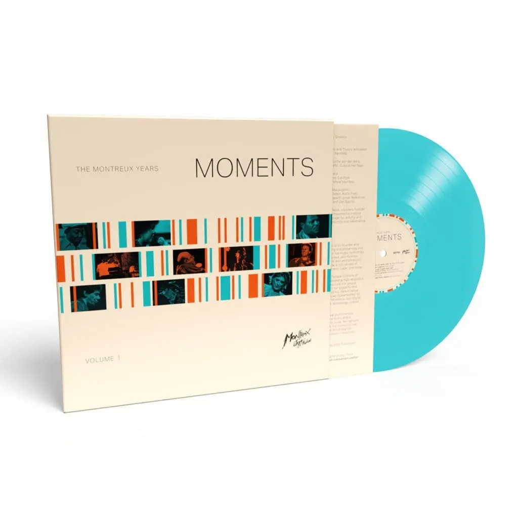 A turquoise Moments - Volume 1, The Montreux Years, Vinyl is partially slid from its sleeve, which displays geometric patterns, photos of musicians, the album title, and a signature in the bottom right corner.