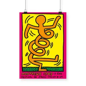 The Poster Keith Haring, 1983 - Pink features a bold abstract orange figure in black outline on a yellow background, dancing with swirling lines. Below is the text “Montreux 1983, 17ème Festival de Jazz - Juillet 8-24” on a pink border.