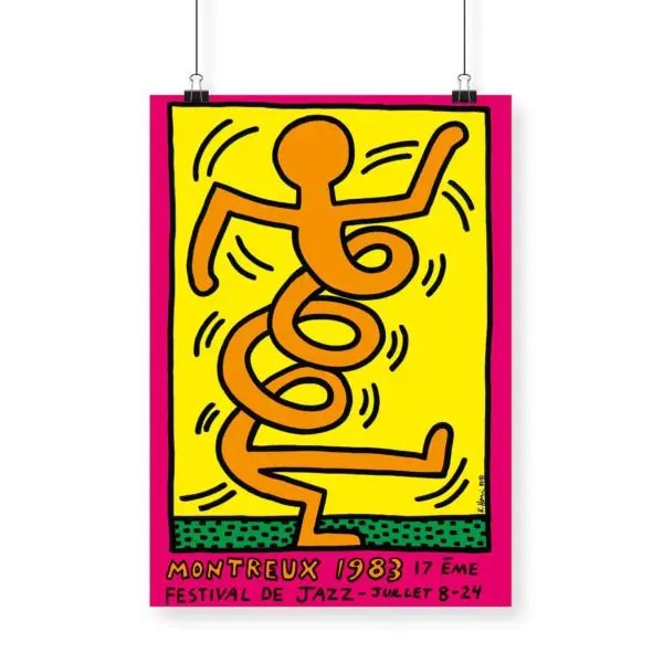 The Poster Keith Haring, 1983 - Pink features a bold abstract orange figure in black outline on a yellow background, dancing with swirling lines. Below is the text “Montreux 1983, 17ème Festival de Jazz - Juillet 8-24” on a pink border.