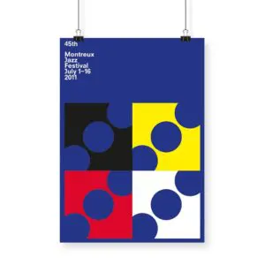 The Poster Francis Baudevin, 2011 features four squares—black, yellow, red, and white—each with blue circular cutouts on a blue background, with white Montreux Jazz Festival text in the top left corner.