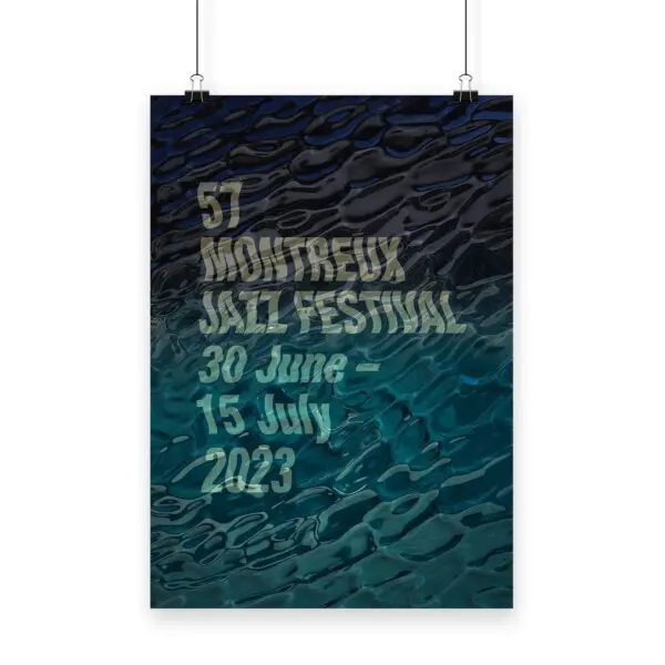 Poster Guillaume “SupaKitch” Grando, 2023, created for the 57th Montreux Jazz Festival, displays event dates 30 June – 15 July 2023 in bold, textured text over a blue and black rippled water background.