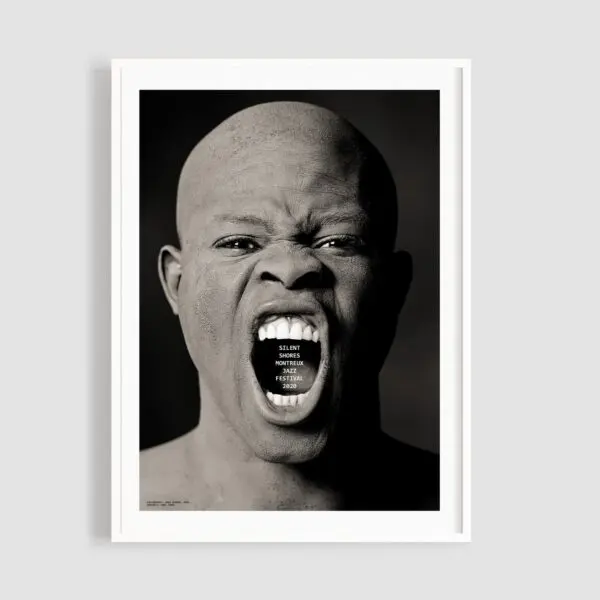 Poster Silent Shores by Greg Gorman features a striking black and white portrait of a person with a shaved head screaming, the words “SILENCE NEVER MADE HISTORY. POSTER FOR PEACE.” inside their mouth, framed by a white border.