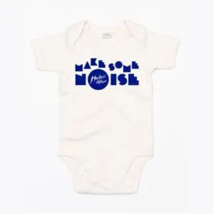 The Body Baby Make Some Noise is a white onesie featuring bold blue "MAKE SOME NOISE" text and a central circle with the Montreux Jazz Festival logo.