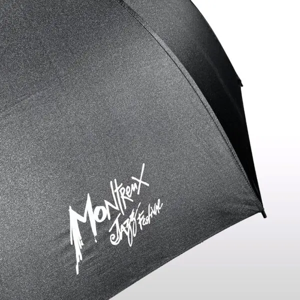 The Big Umbrella Montreux Jazz Festival features bold white stylized festival text on one panel, set against a subtle light gradient background.