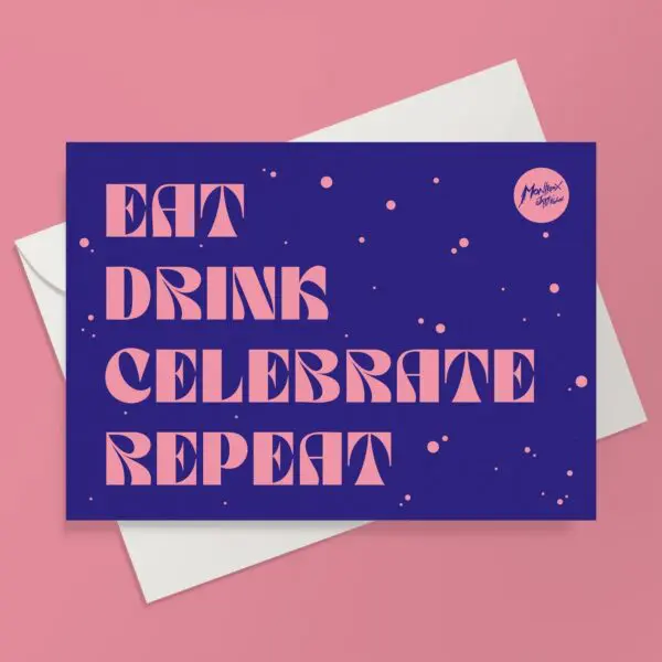 The Eat Drink Celebrate Repeat Card features bold pink text on a blue cover reading "EAT DRINK CELEBRATE MUSIC REPEAT," set on a pink background with pink dots and a small circle in the top right corner.