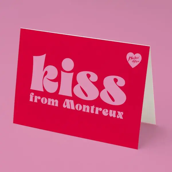 The Kiss Card features bold pink "Kiss from Montreux" text and a small heart with "Montreux, Suisse" on a red background—displayed on pink, it’s the perfect greeting card for any Kiss Montreux Jazz Festival fan.