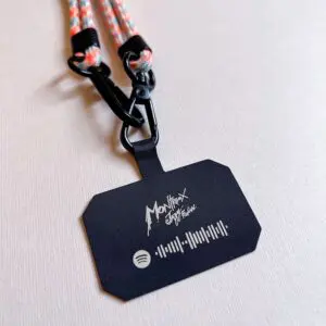 The Mobile Strap, Lakeside, is a black rectangular badge on a lanyard featuring the Montreux Jazz Festival and Spotify logos plus a scannable code, designed as a stylish accessory for Montreux Jazz fans.