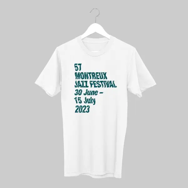 The T-Shirt Guillaume "SupaKitch" Grando, 2023, hangs against a gray background with teal text on the front: 57 Montreux Jazz Festival, 30 June – 15 July 2023.