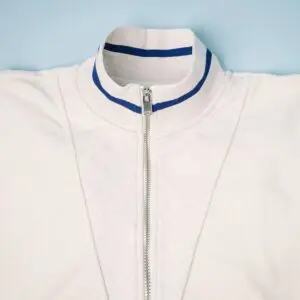 A close-up of the Sweat Unisex Terry Cloth Zip-Up Trucker Collar, Vintage, featuring two blue stripes, laid flat on a light blue background.