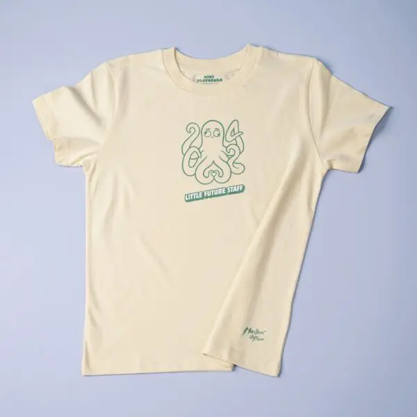 The T-Shirt Rylsee Octopus, Baby is a pale yellow tee with Rylsee's green cartoon octopus holding a fork and spoon on the chest. "LITTLE FUTURE STAFF" appears below, plus a small green signature near the hem.