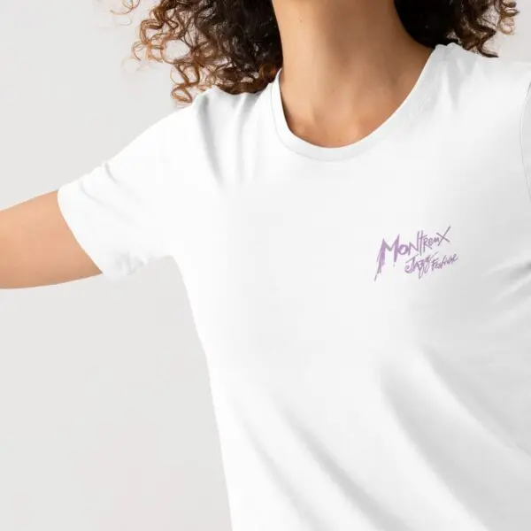 A person with curly hair wears the Limited Edition T-Shirt Lineup 2025, featuring a small purple Montreux Jazz Festival logo on the left chest. Only part of the upper body is shown against a plain background.