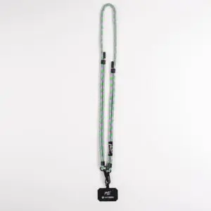The Mobile Strap, Lakeside is a long, braided lanyard in green, purple, and gray, with black clips and a black tag with white text—designed as a stylish mobile accessory inspired by the Montreux Festival, shown on a plain white background.
