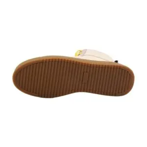 The image displays the bottom view of the beige Lakeside Wooler Sneaker by Baabuk, Limited Edition, featuring a light brown, ribbed rubber sole for traction. The upper part of this sneaker is inspired by the Montreux Festival and is partially visible.